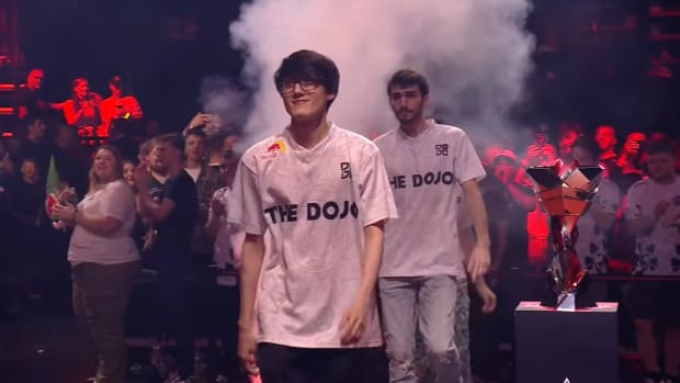 iiTzTimmy walks on stage with his team, The Dojo, for the final days of the ALGS 2023 Championship in the Apex Legends Global Series.